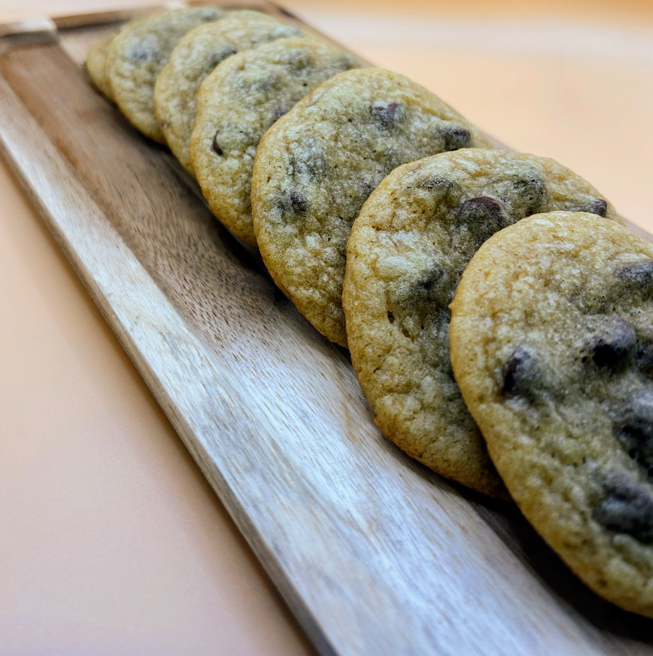Chocolate chip cookies on a wooden cutting board