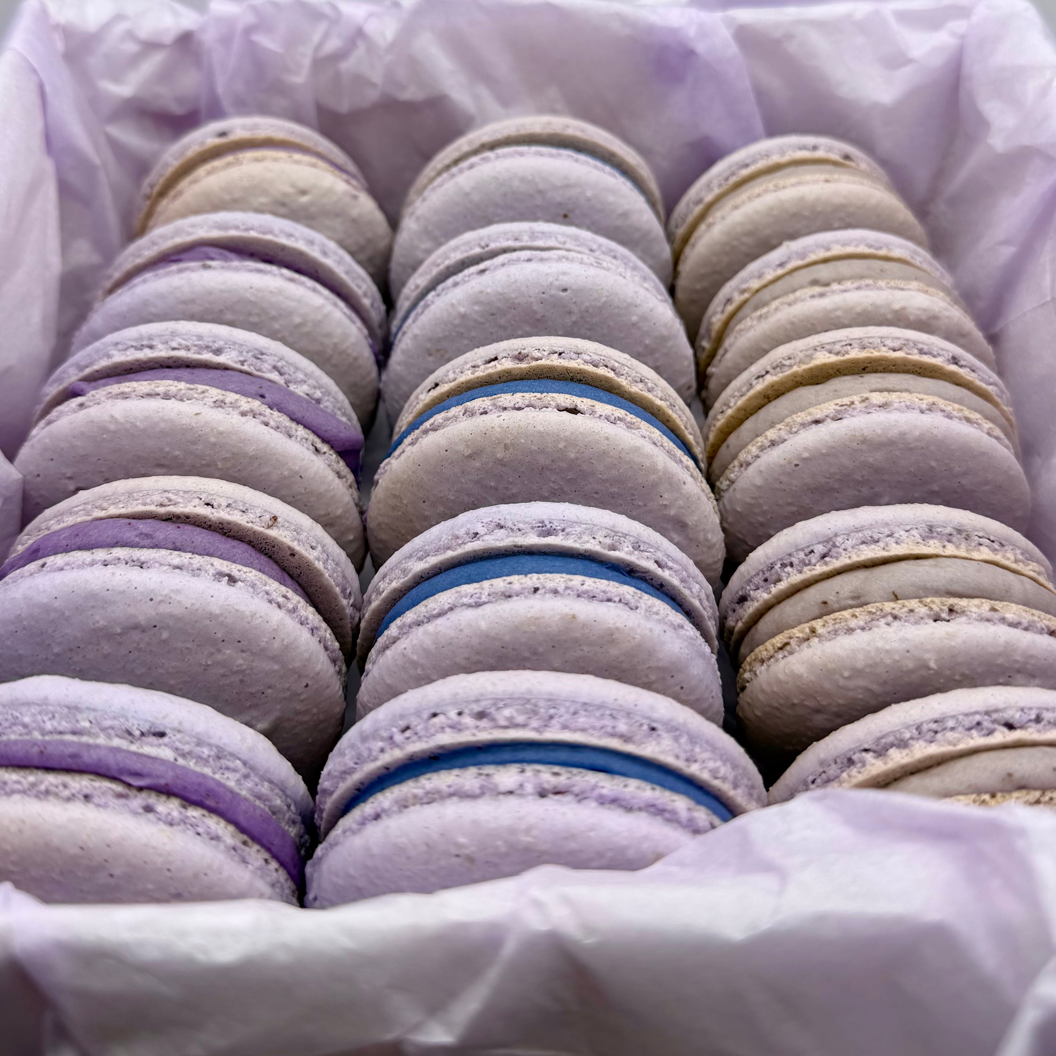 Light Purple Macarons with Creamy Vanilla Filling Colored to match an event. 