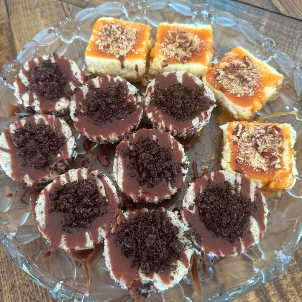 Mini circle oreo cheesecakes with chocolate drizzle and mini square turtle cheesecakes with caramel and pecans. 