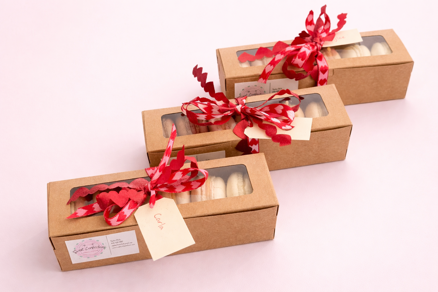 A box of variety flavored macarons packaged in Valentine's Day ribbon. 